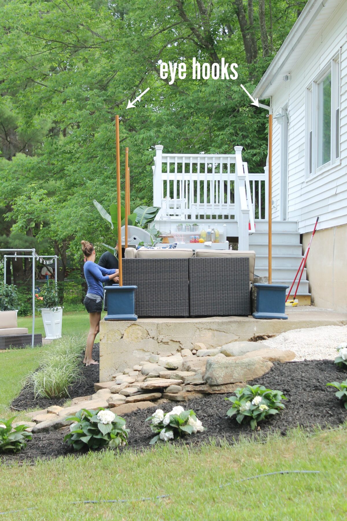 DIY string light poles in backyard